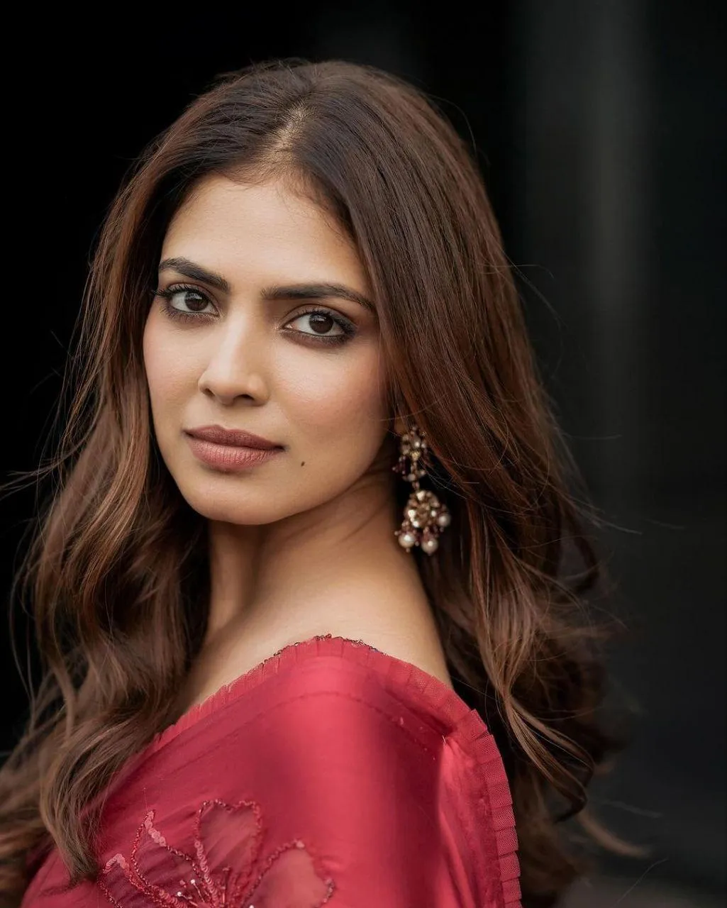 Tempting Malavika Mohanan in Red Saree with Wavy Hairstyle
