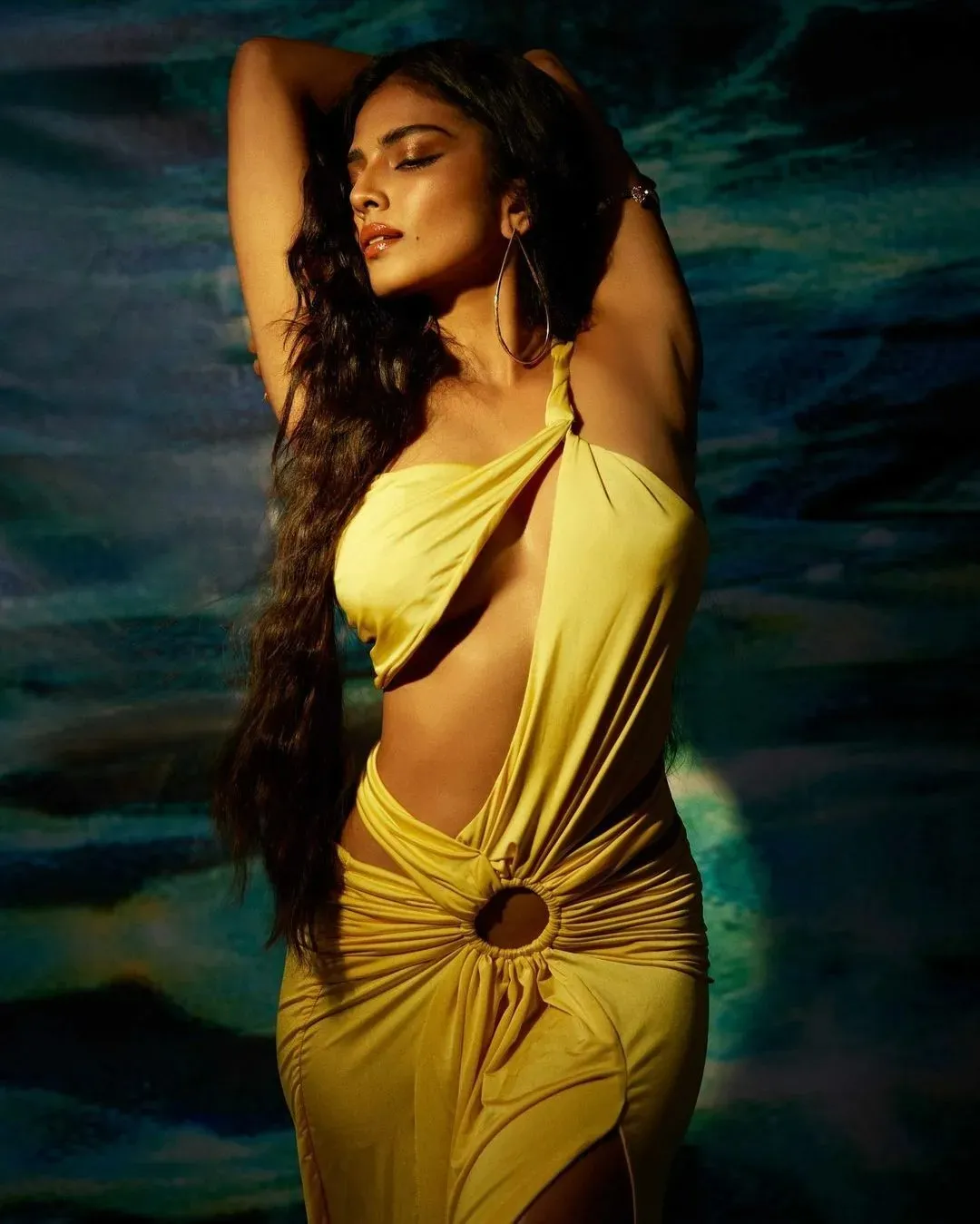 Tempting Malavika Mohanan in Yellow Dress with Gentle Pose