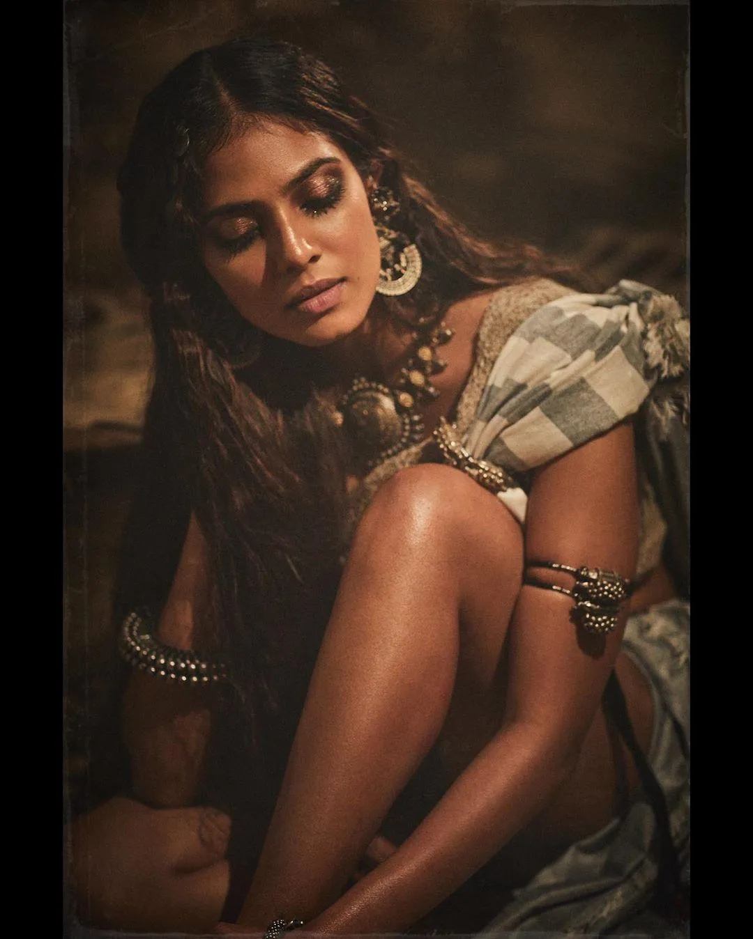 Tempting Malavika Mohanan Posing with Intense Look Wallpaper