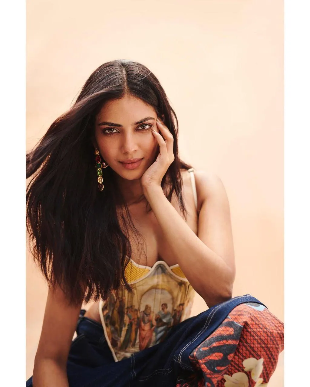 Tempting Malavika Mohanan Seated Casual Look with Smile
