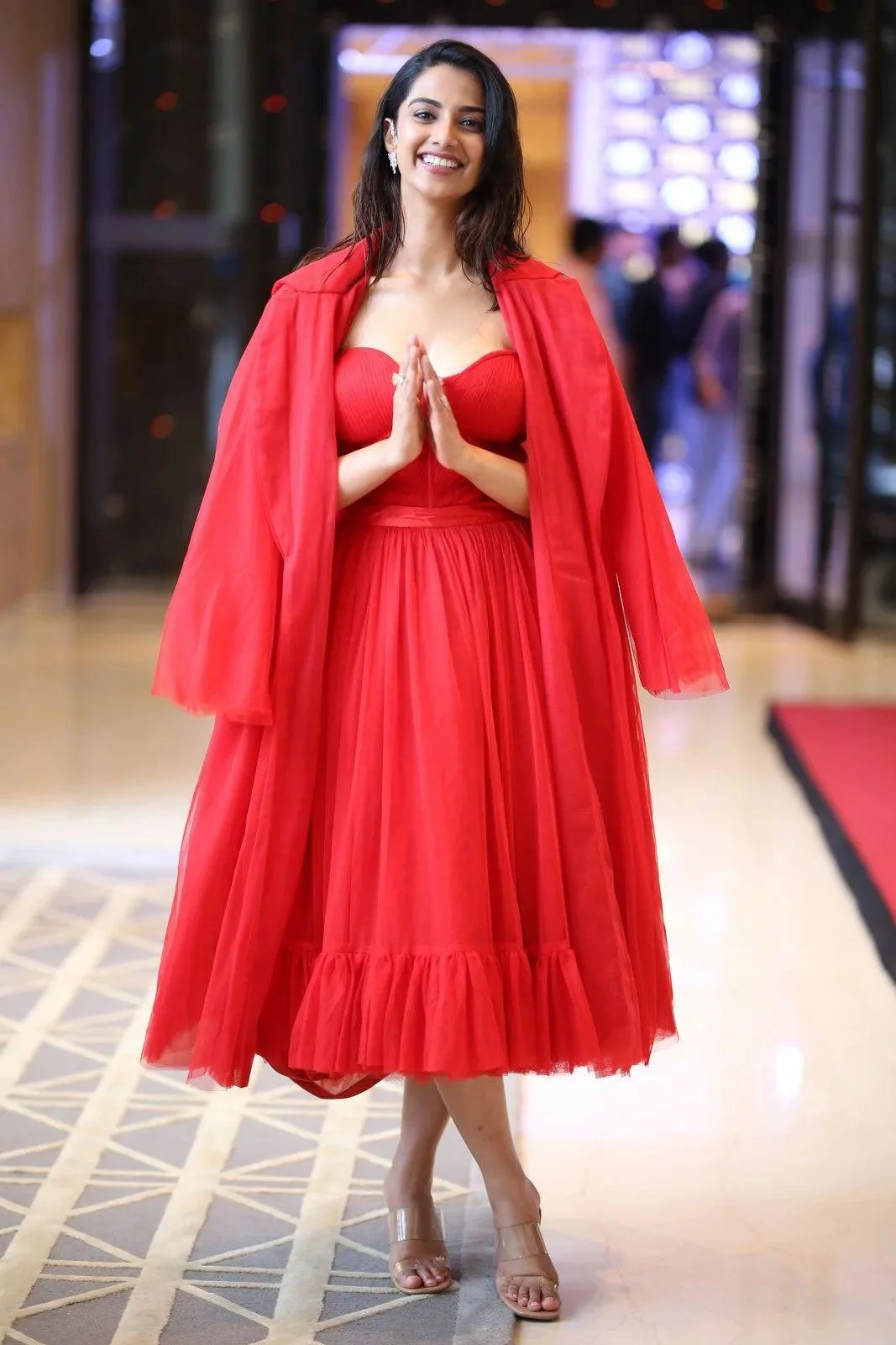 Meenakshi Chaudhary Red Frock HD Image
