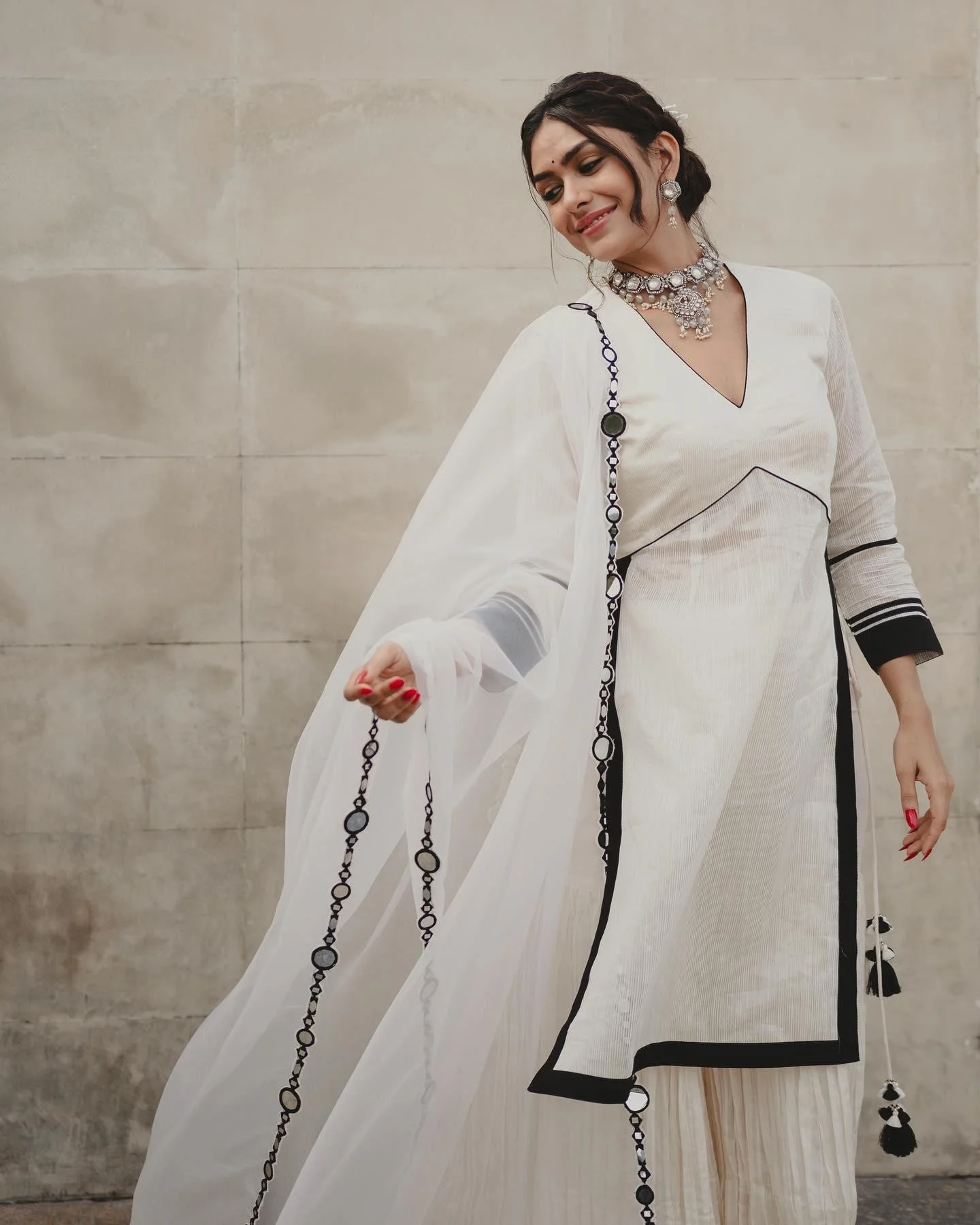 Actress Mrunal Thakur Looks Elegant in white Dress