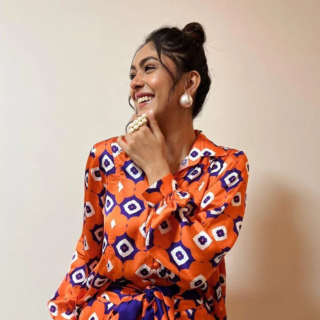 Mrunal Thakur in Vibrant Orange and Purple Dress Hd Image