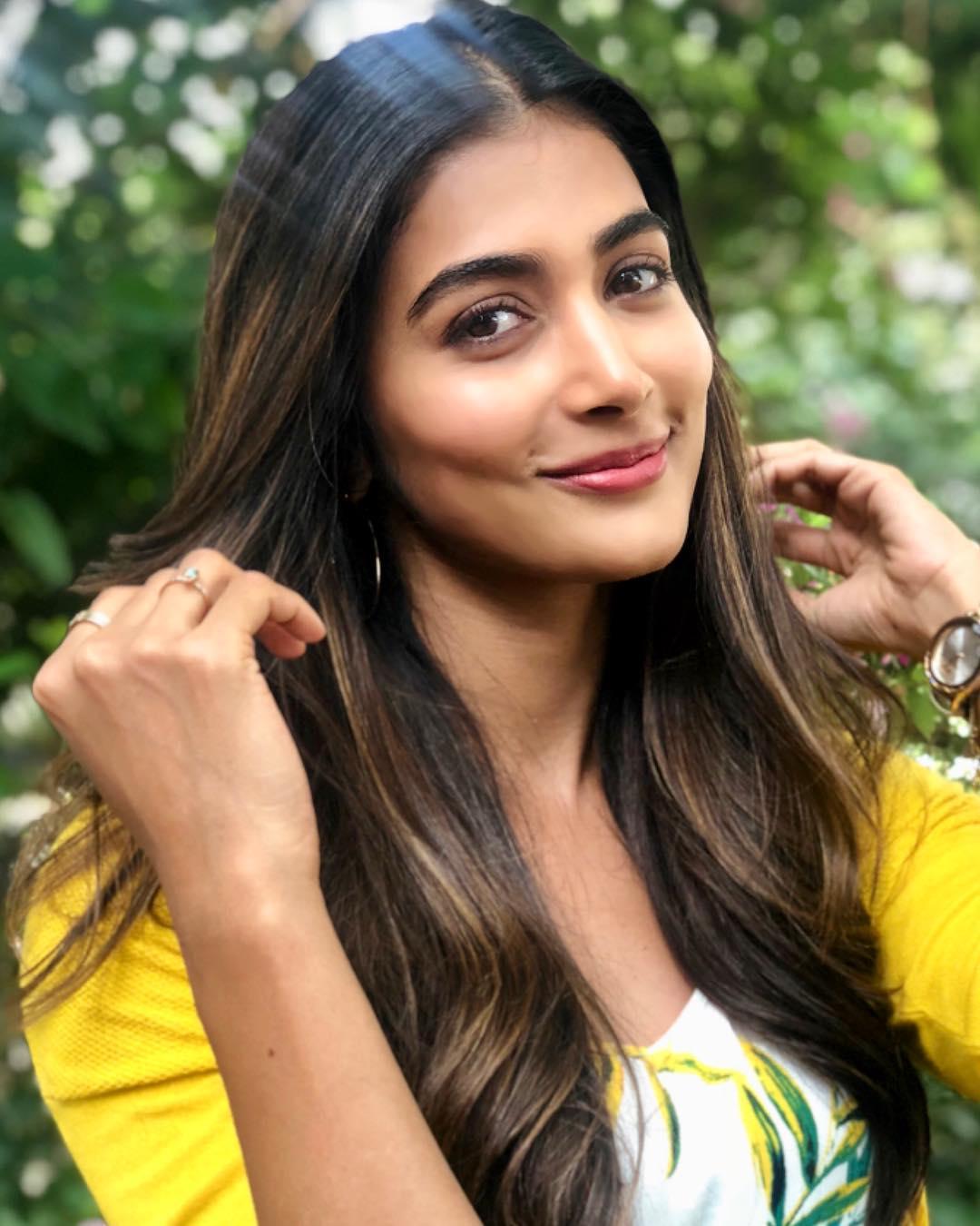 Bright and Happy Pooja Hegde Wearing Yellow Top Outdoors