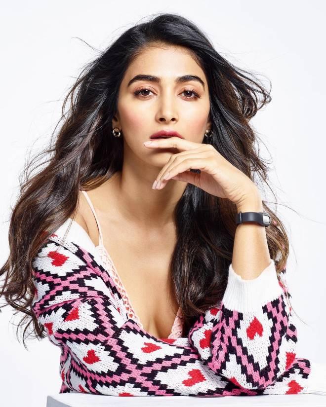 Casual and Relaxed Pose of Pooja Hegde in a Knit Sweater