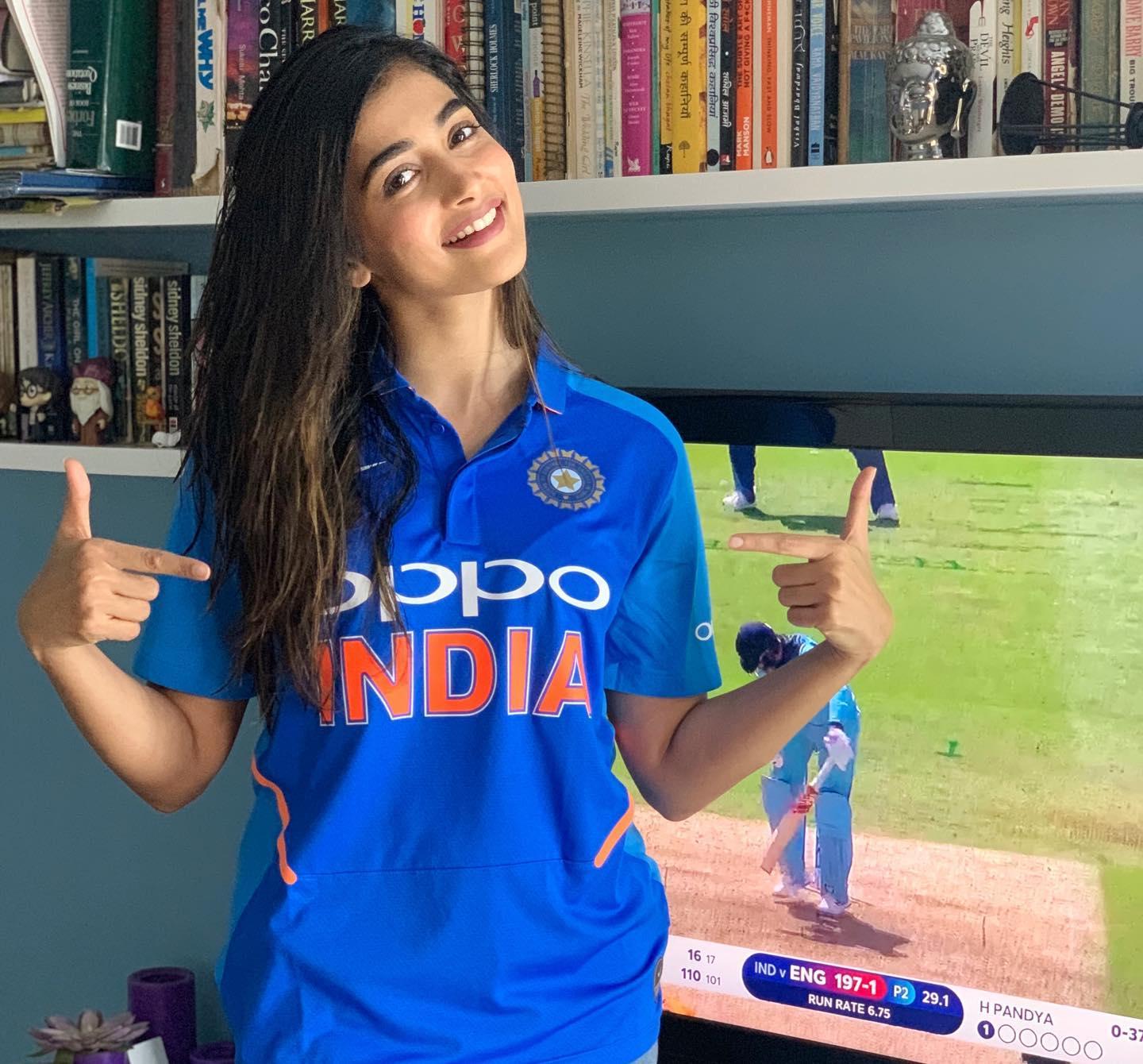 Cheerful Pooja Hegde in Blue India Cricket Jersey Wallpaper