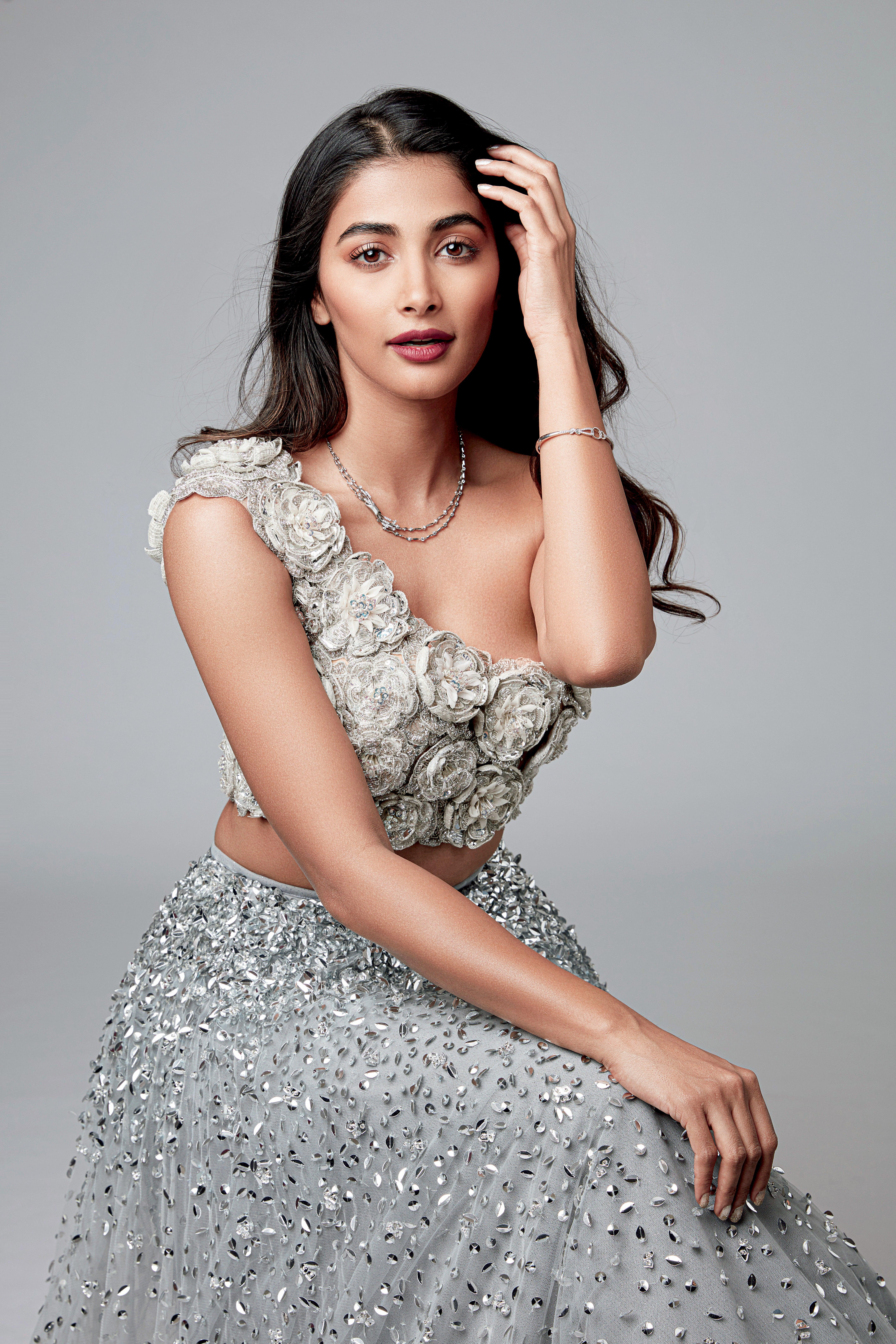 Glamorous Pooja Hegde in Silver Embellished Gown Pose