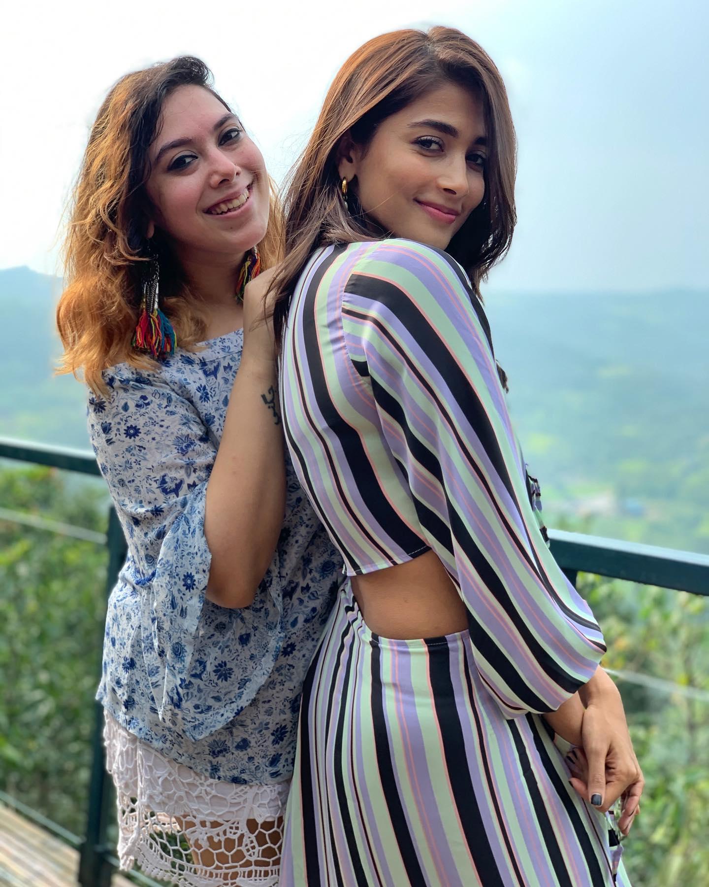 Pooja Hegde and Friend Pose on Scenic Balcony View Image