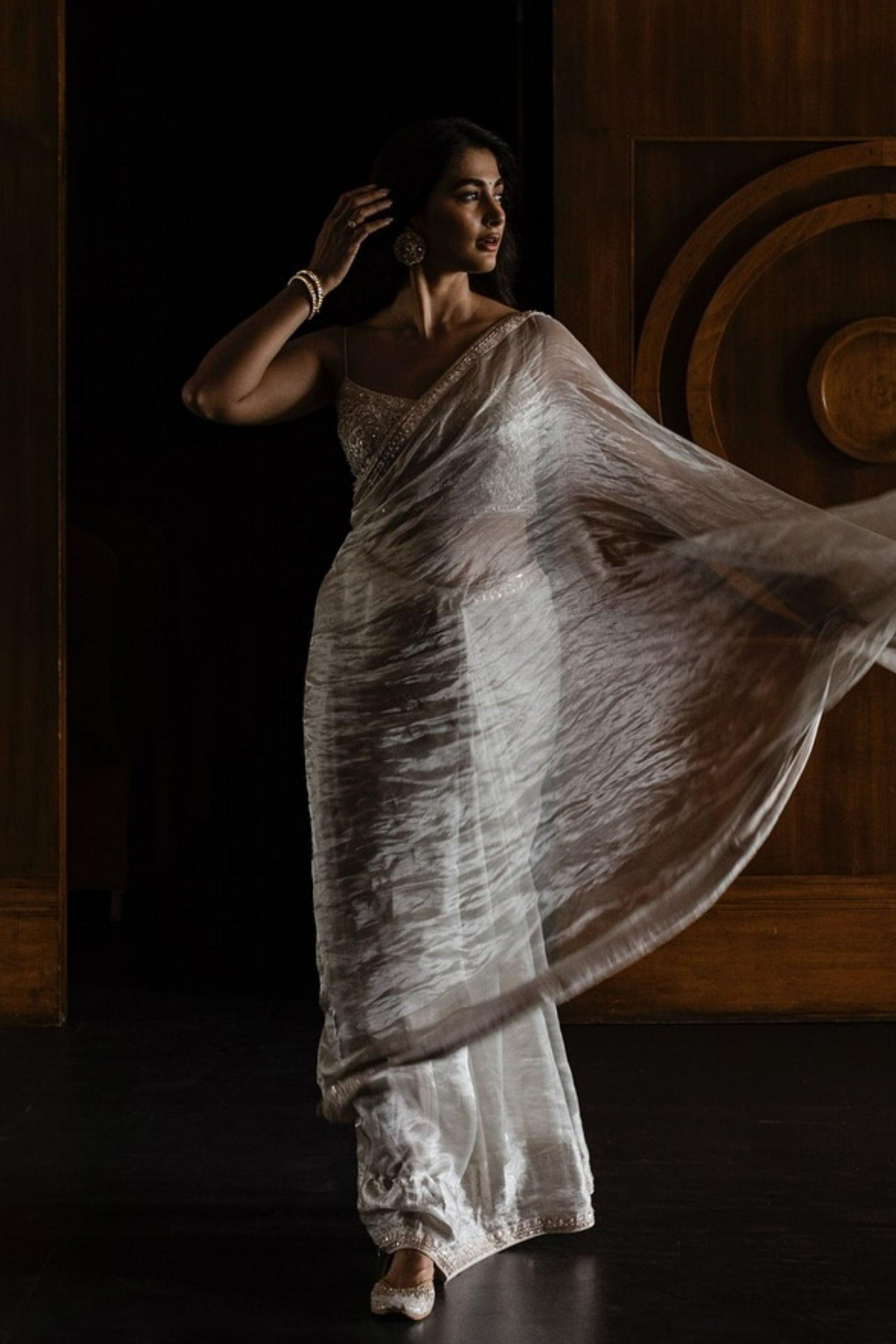 Pooja Hegde Dancing Gracefully in Flowing Traditional Wear