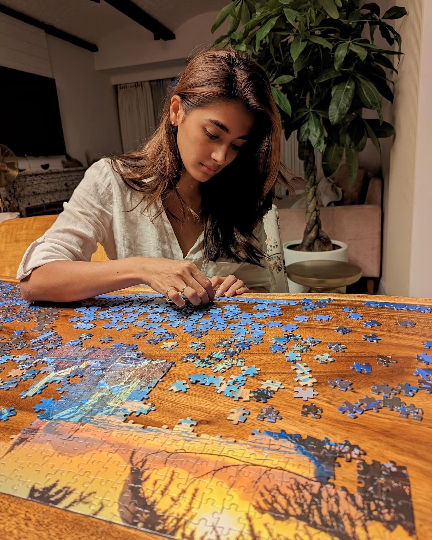 Pooja Hegde Enjoying Puzzle Time in Relaxed Setting Hd