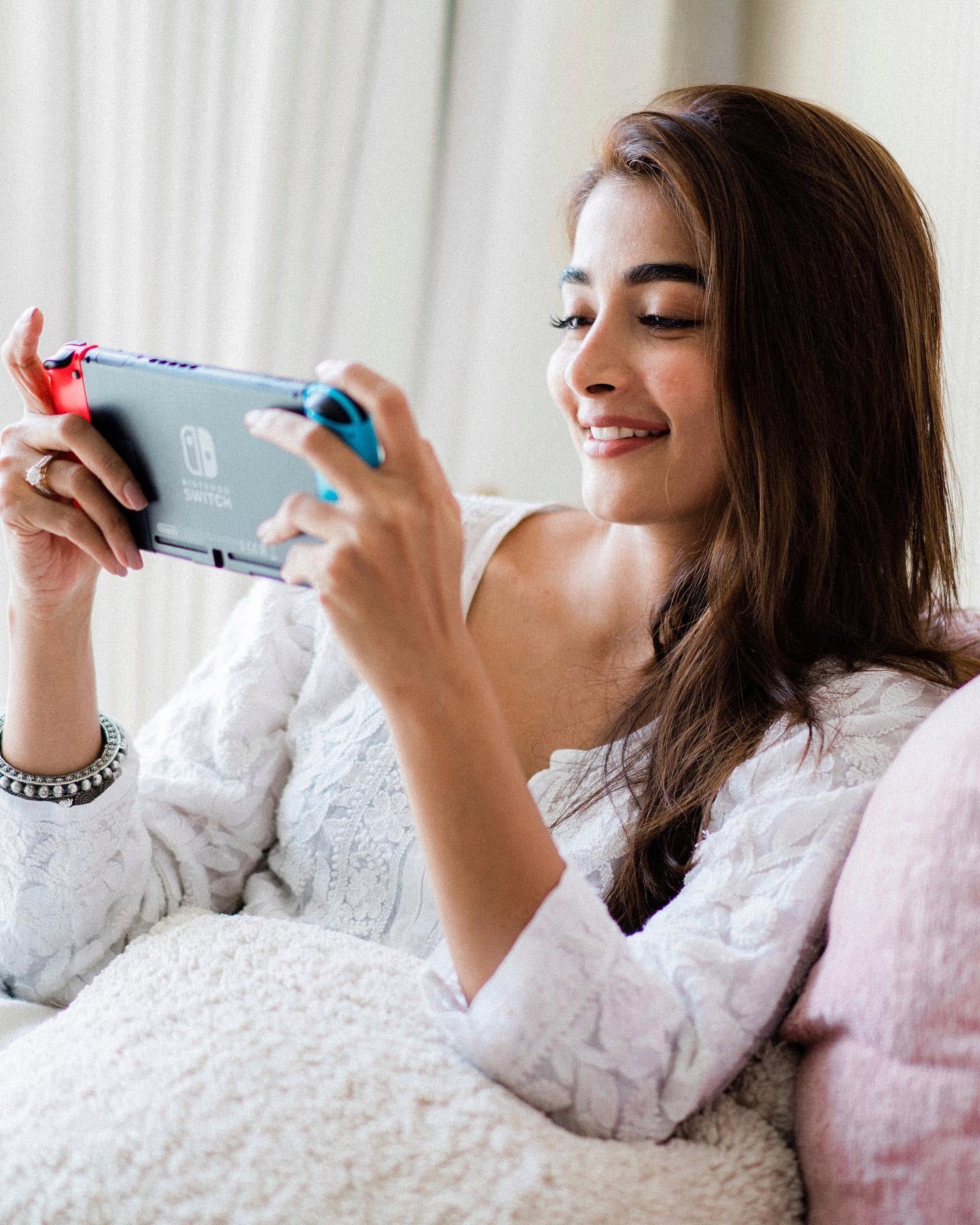 Pooja Hegde Enjoys Gaming in Cozy Home Outfit Wallpaper