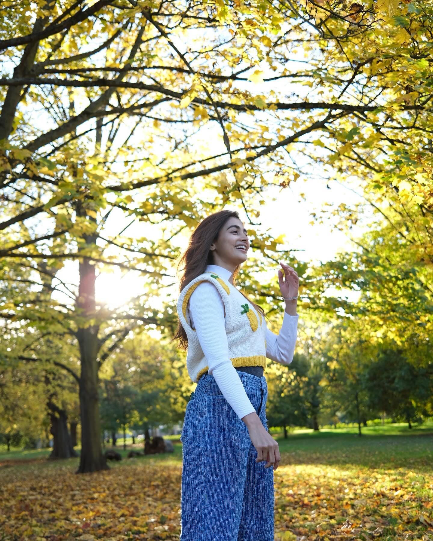 Pooja Hegde Enjoys Nature in White Sweater and Blue Pants