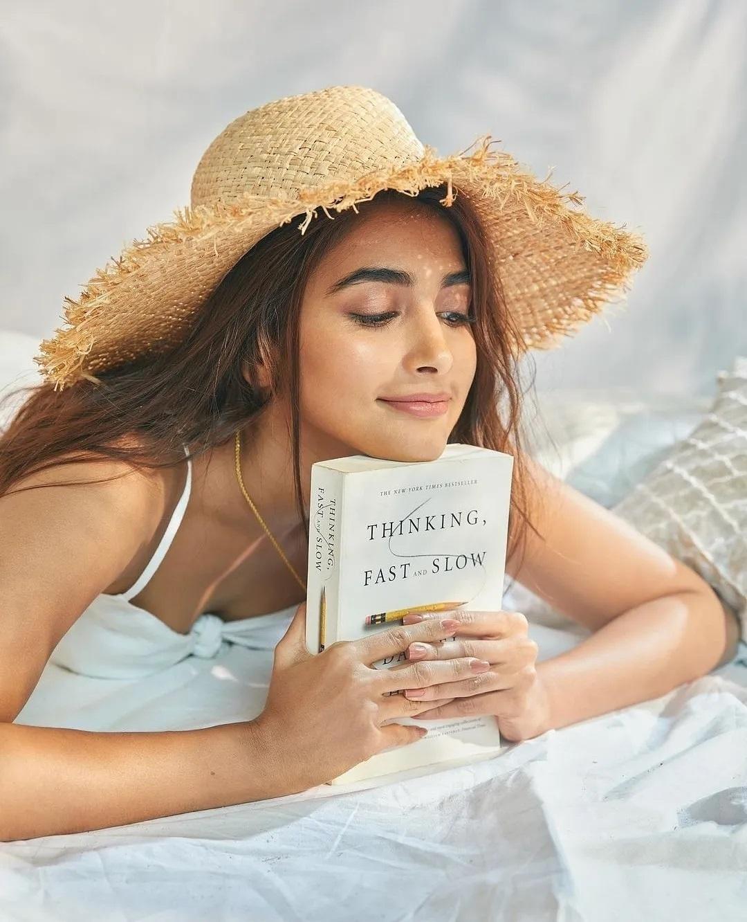 Pooja Hegde Enjoys Reading Outdoors in Summer Attire