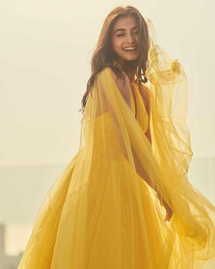 Pooja Hegde Glows in Flowing Yellow Dress Under Soft Light