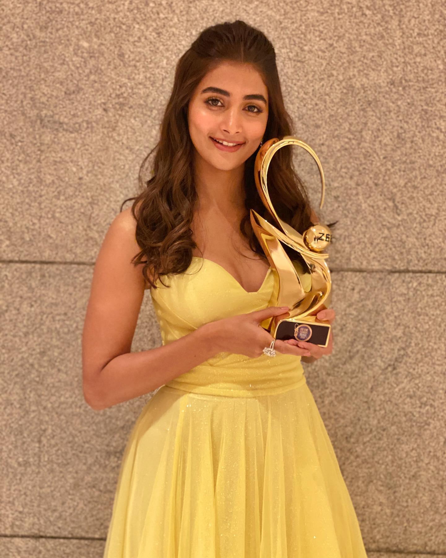 Pooja Hegde Holding Award Wearing Yellow Dress Smiling