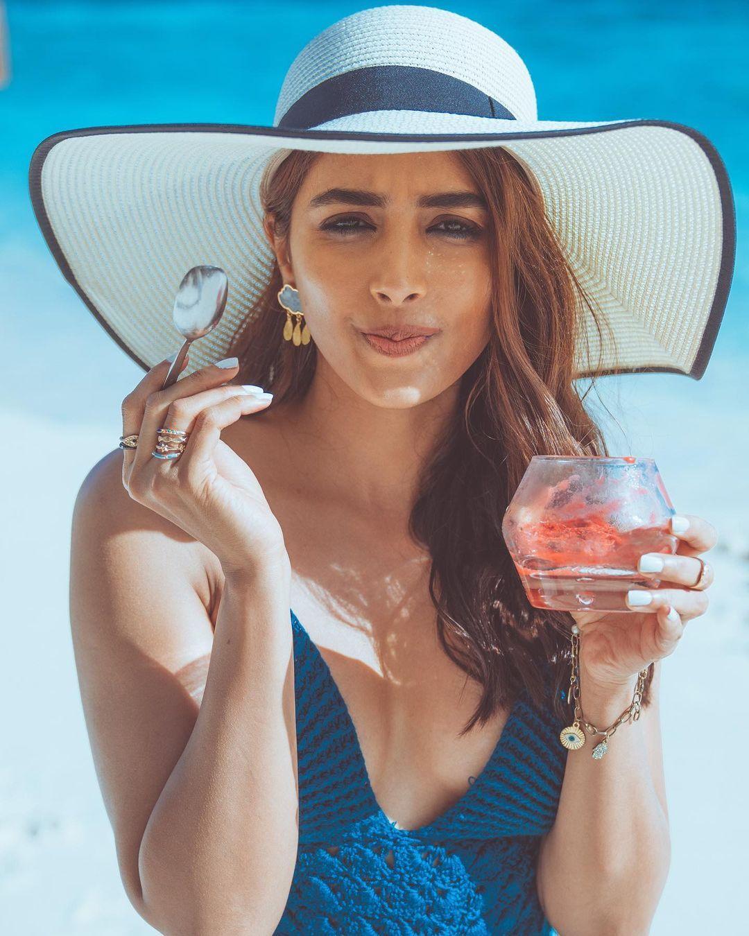 Pooja Hegde Holding Dessert Wearing Blue Dress and Big Hat