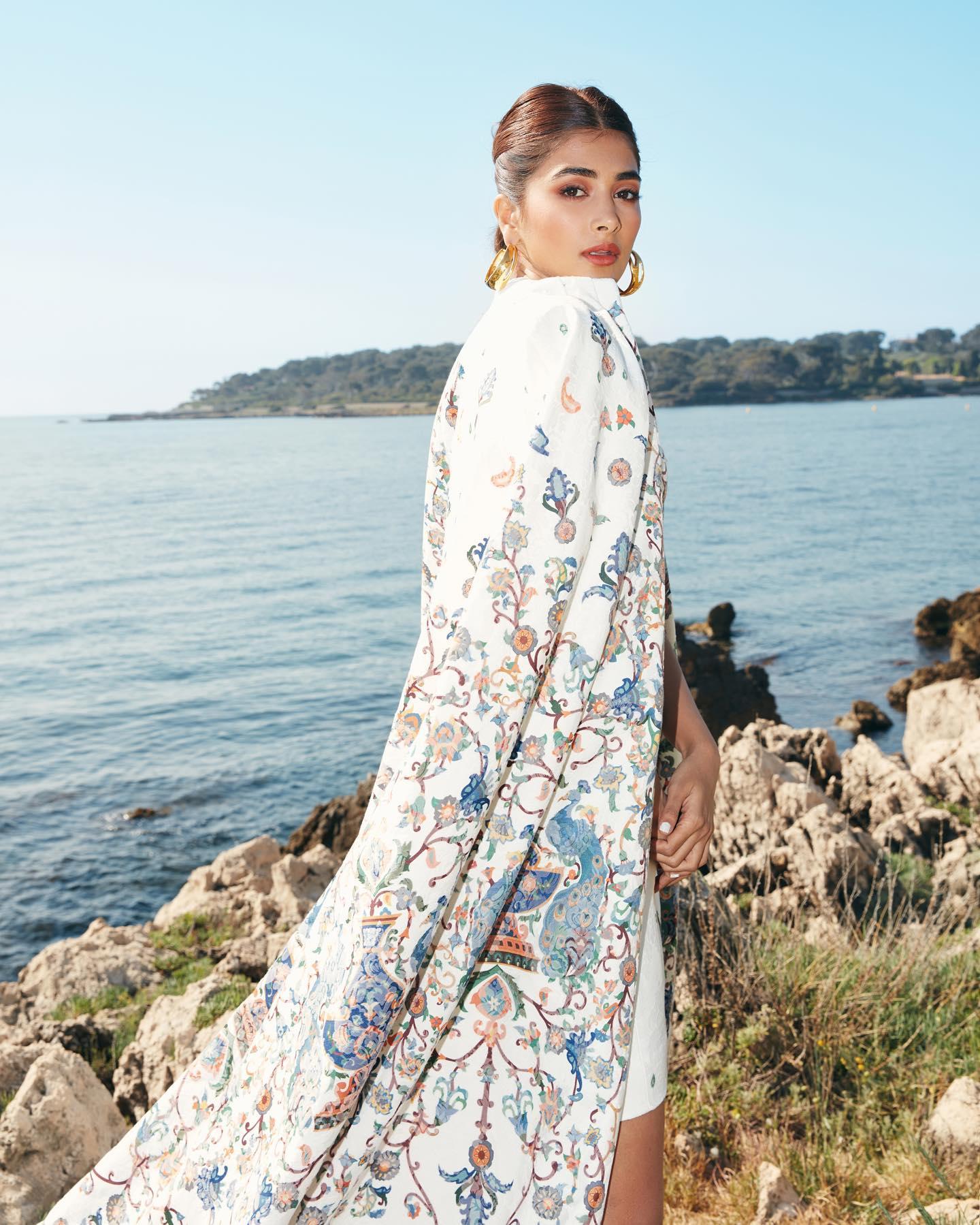 Pooja Hegde in a Floral Outfit Near Ocean Rocks Wallpaper