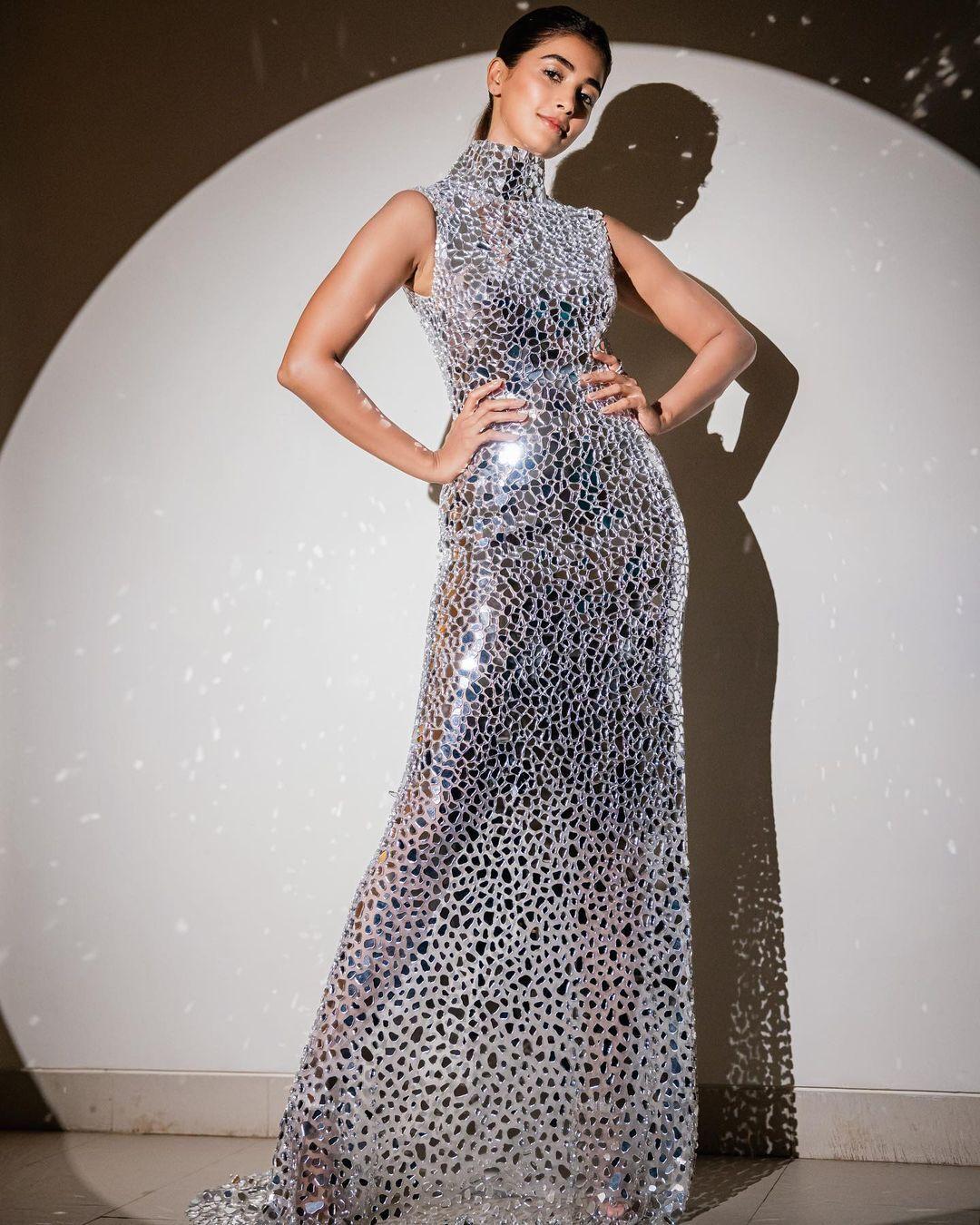Pooja Hegde in a Sparkling Silver Gown on Stage Wallpaper