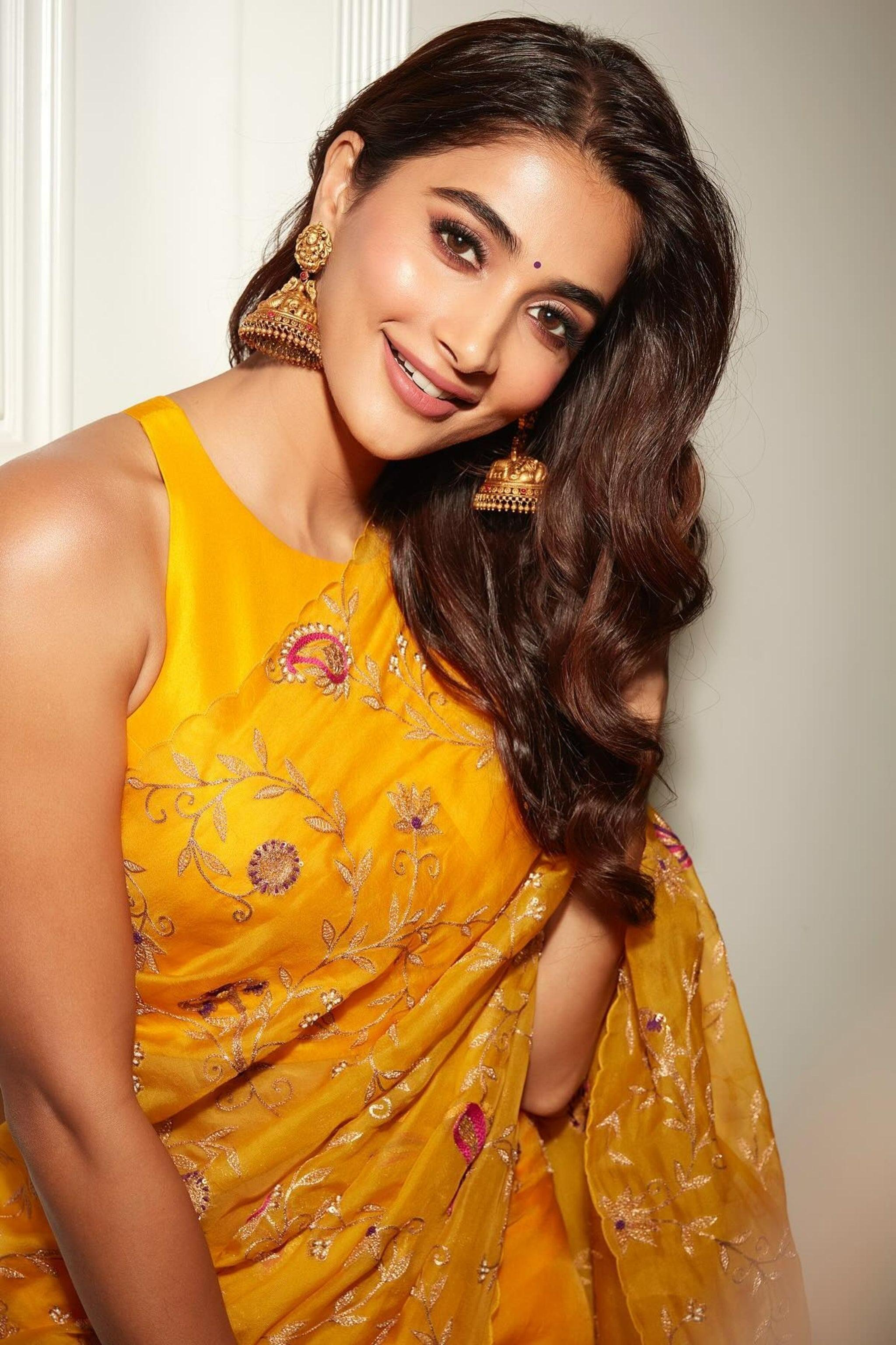 Pooja Hegde in Bright Yellow Saree Smiling At the Camera