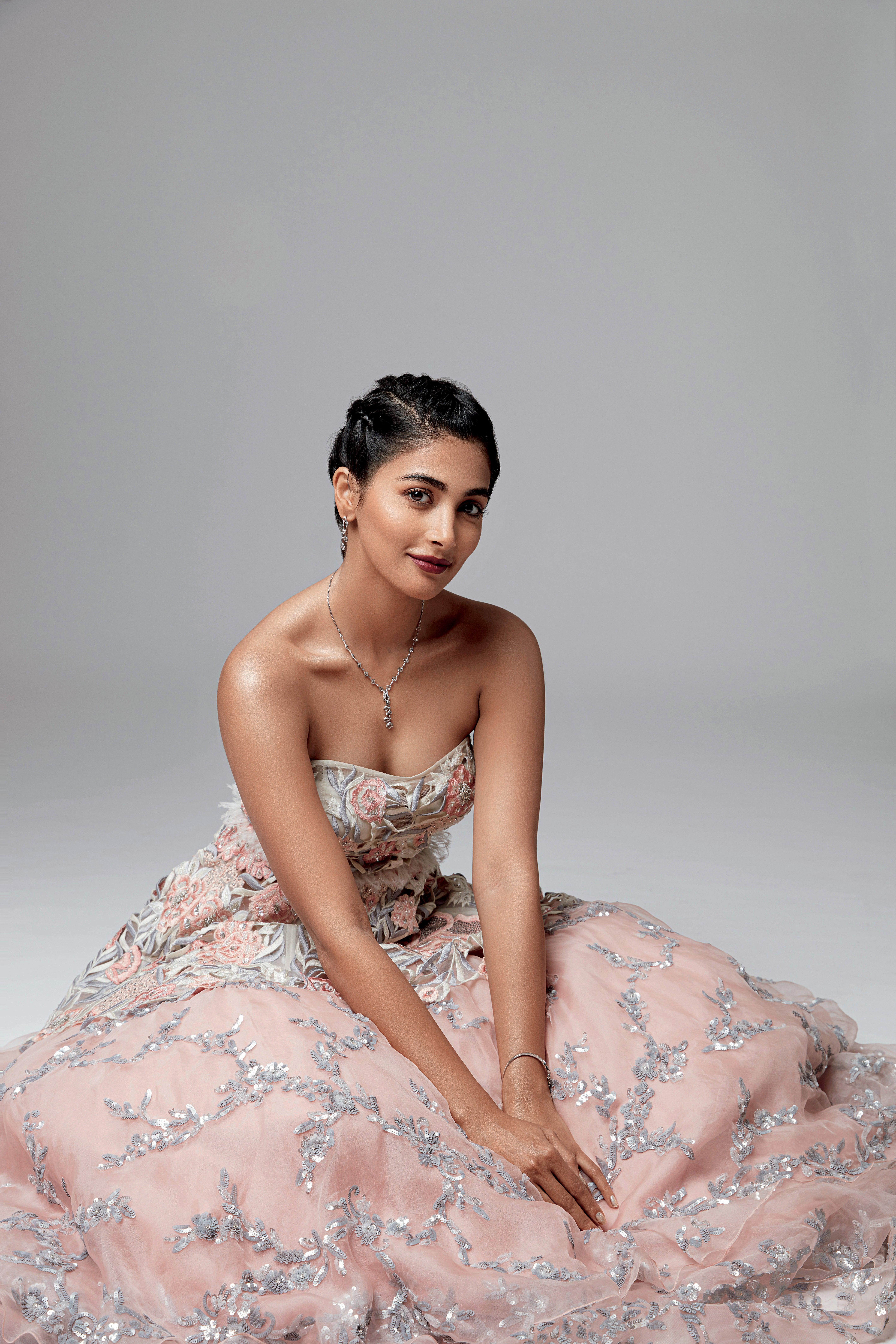 Pooja Hegde in Floral Pastel Gown Seated on Studio Floor