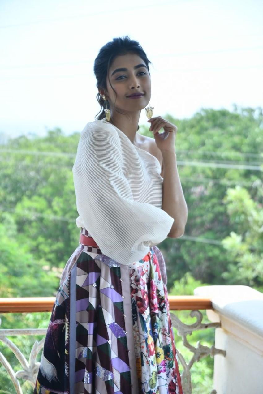 Pooja Hegde in Floral Skirt and White Top on Balcony