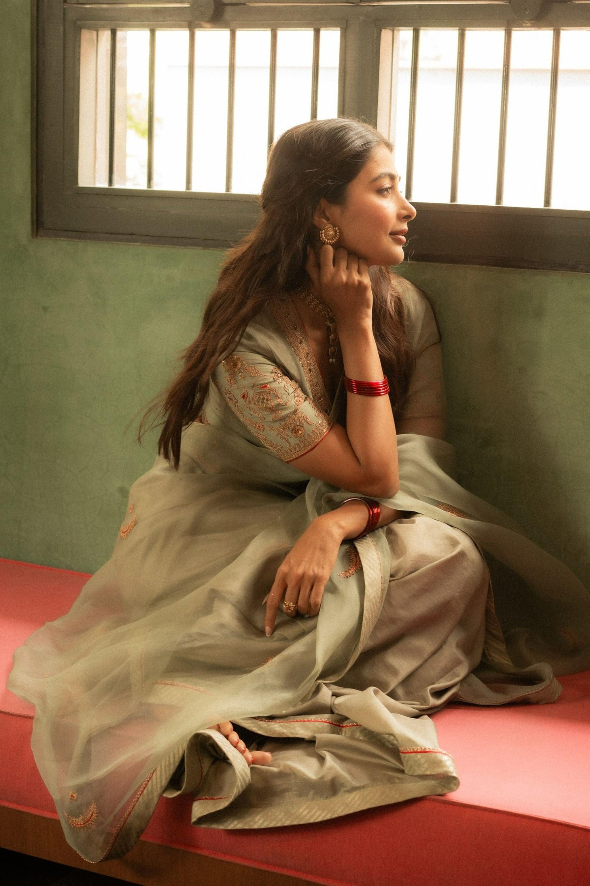 Pooja Hegde in Saree Sitting By the Window Looking Calm