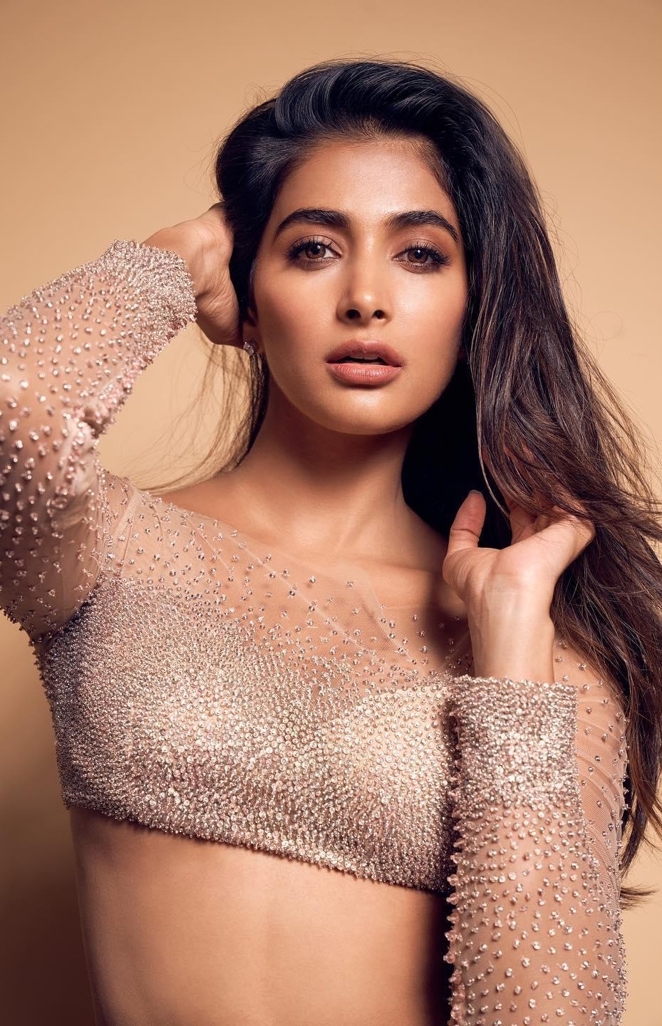 Pooja Hegde in Shimmery Peach Crop Top with Bold Pose