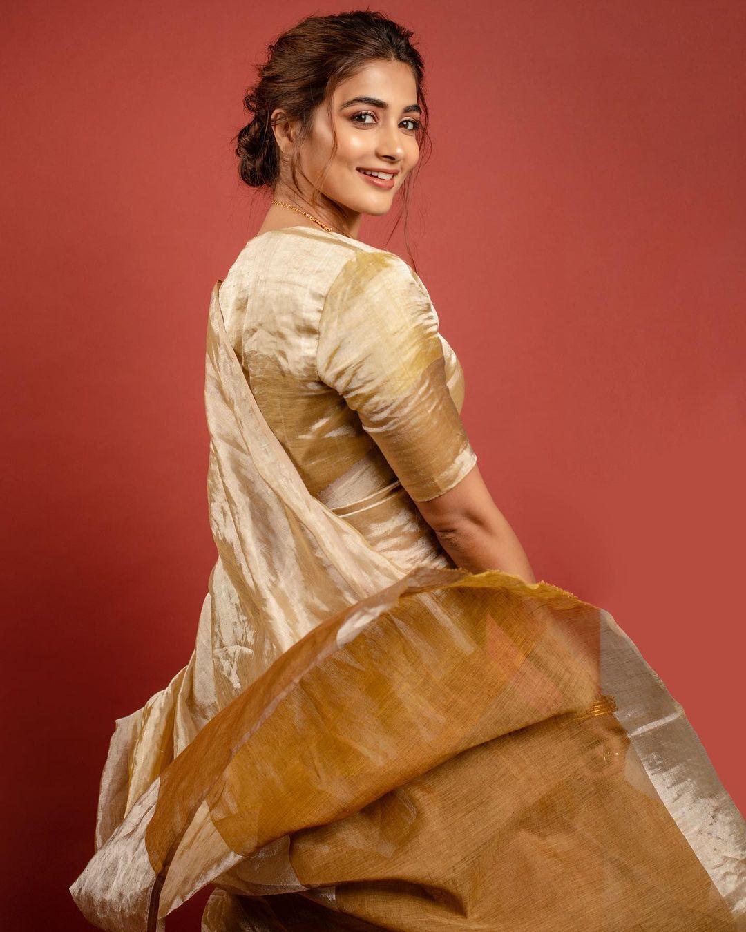 Pooja Hegde in Silk Saree Smiling Over Her Shoulder