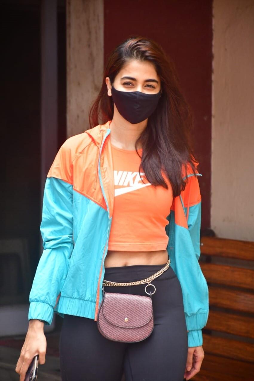 Pooja Hegde in Sporty Look with Mask and Crossbody Bag