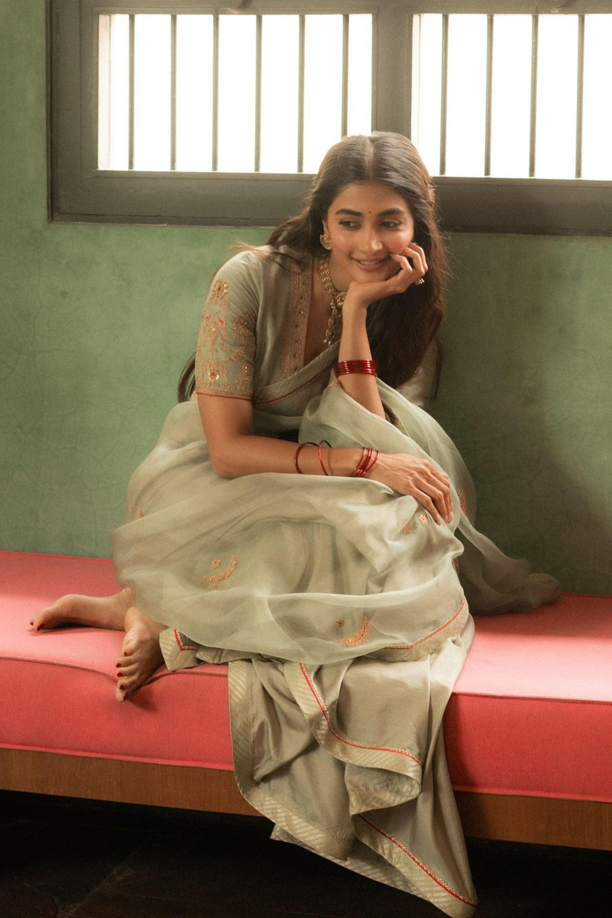 Pooja Hegde in Traditional Attire Sitting Near Window
