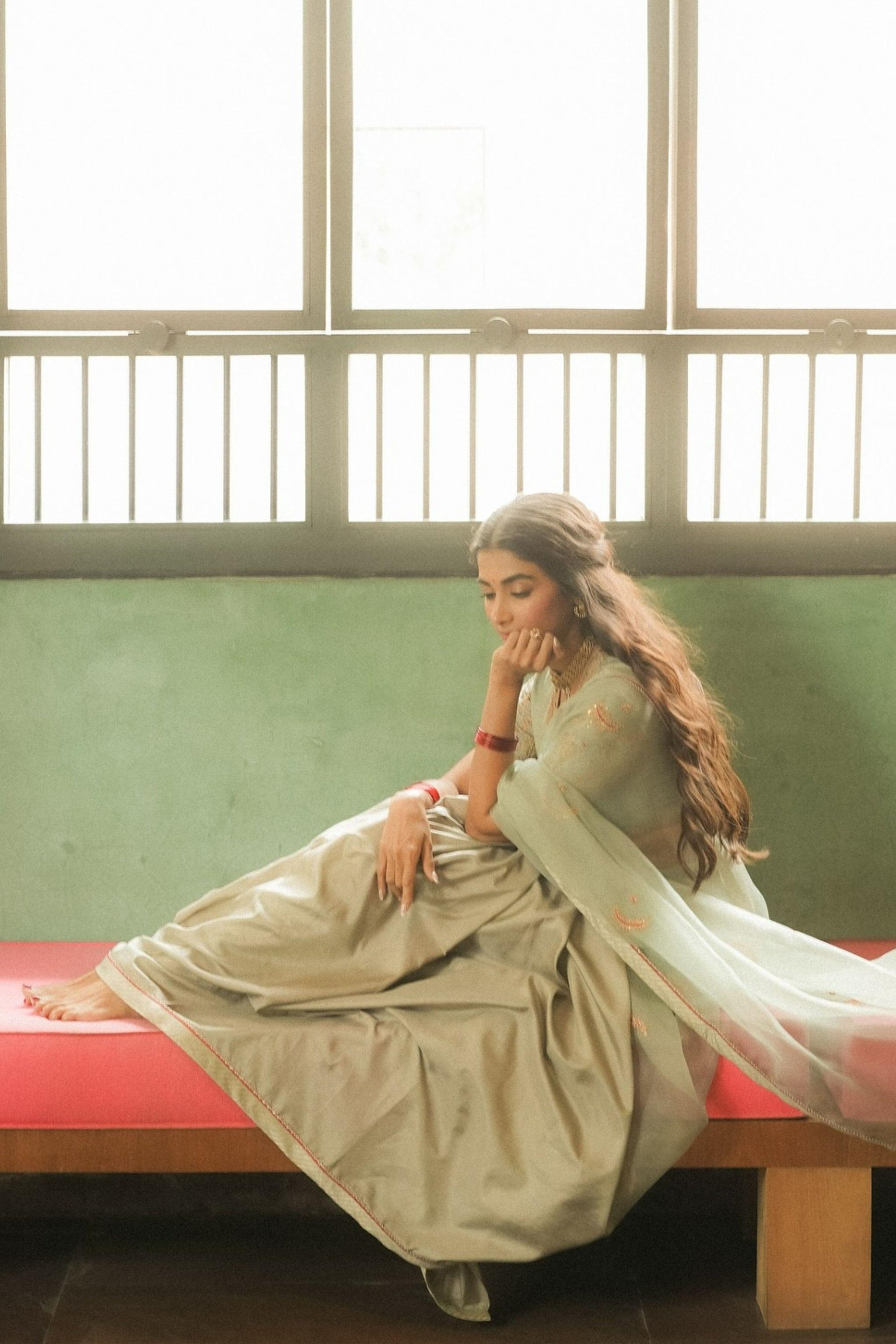 Pooja Hegde in Vintage Gown Near Soft Window Light Image