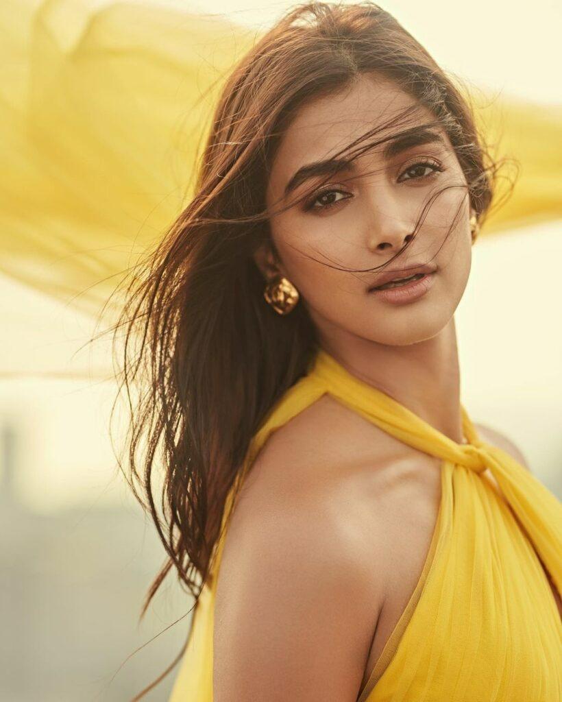Pooja Hegde in Yellow Halter Dress with Windblown Hair