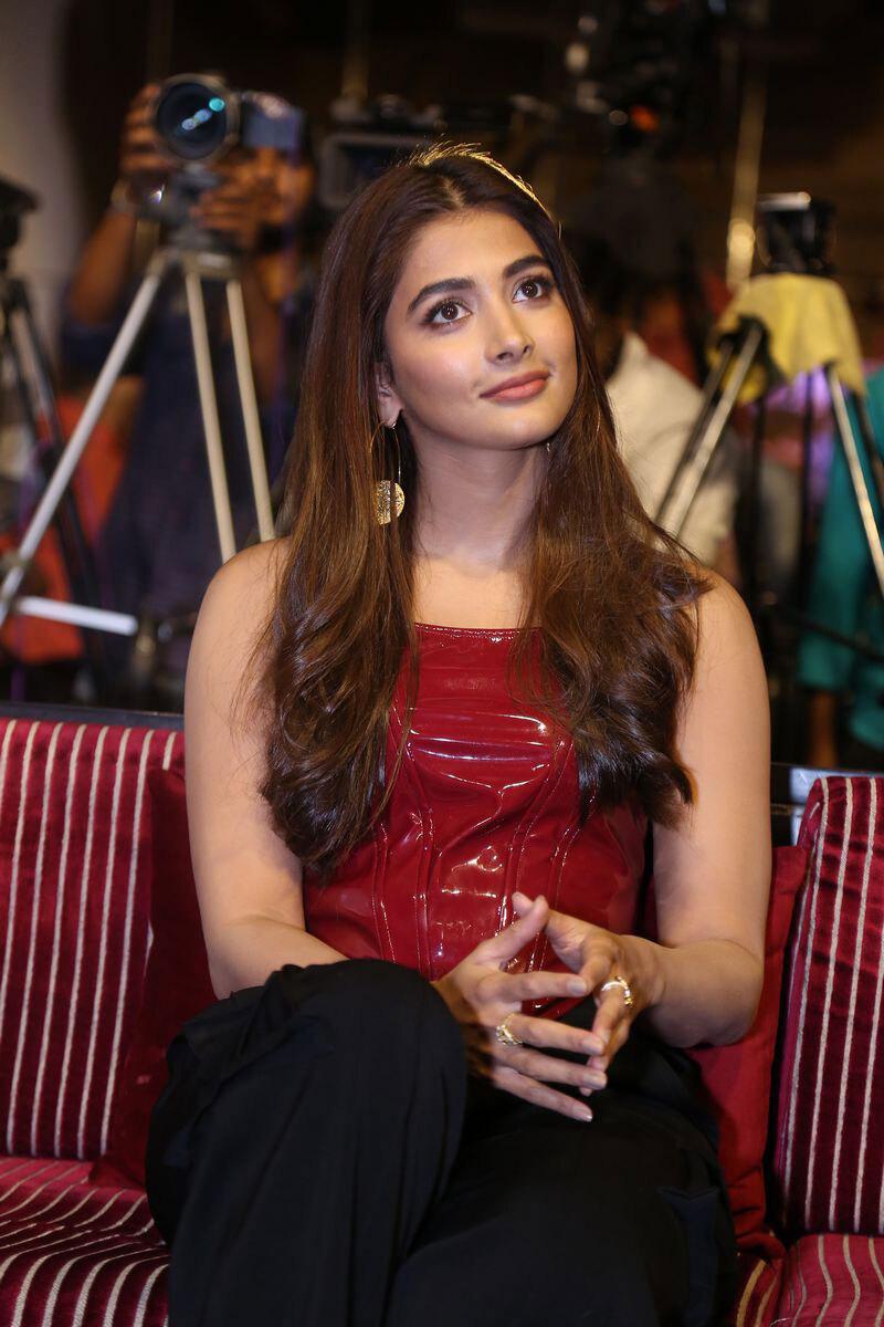 Pooja Hegde Laughs in a Red Top At a Public Event Image