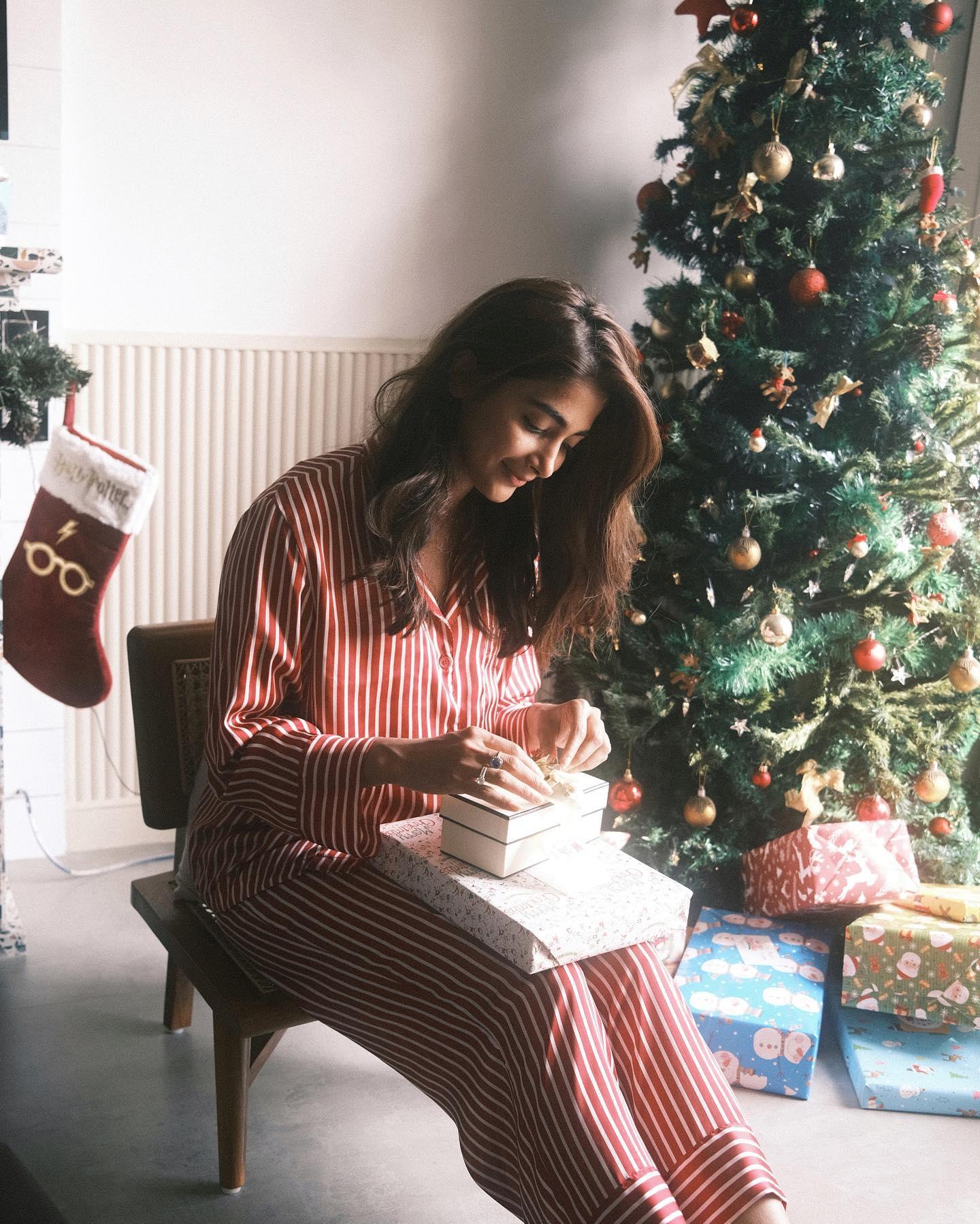 Pooja Hegde Opening Gifts Near Decorated Christmas Tree