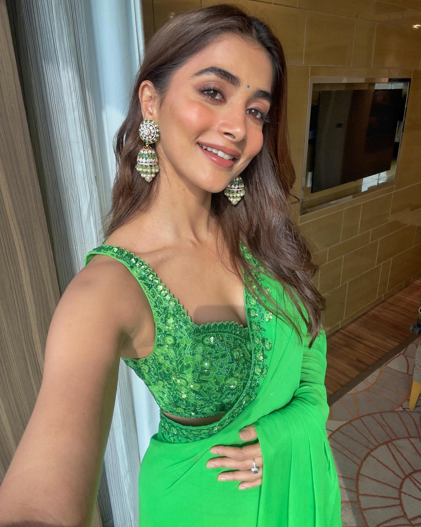 Pooja Hegde Poses in a Sleeveless Green Saree Wallpaper
