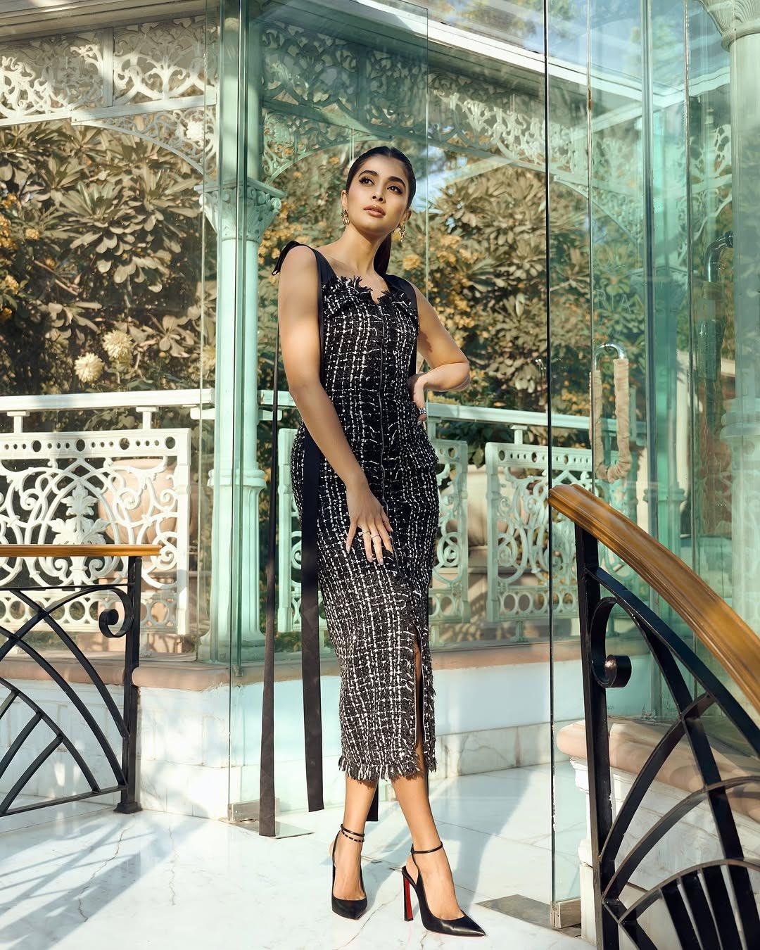 Pooja Hegde Poses in Black Dress At a Grand Staircase