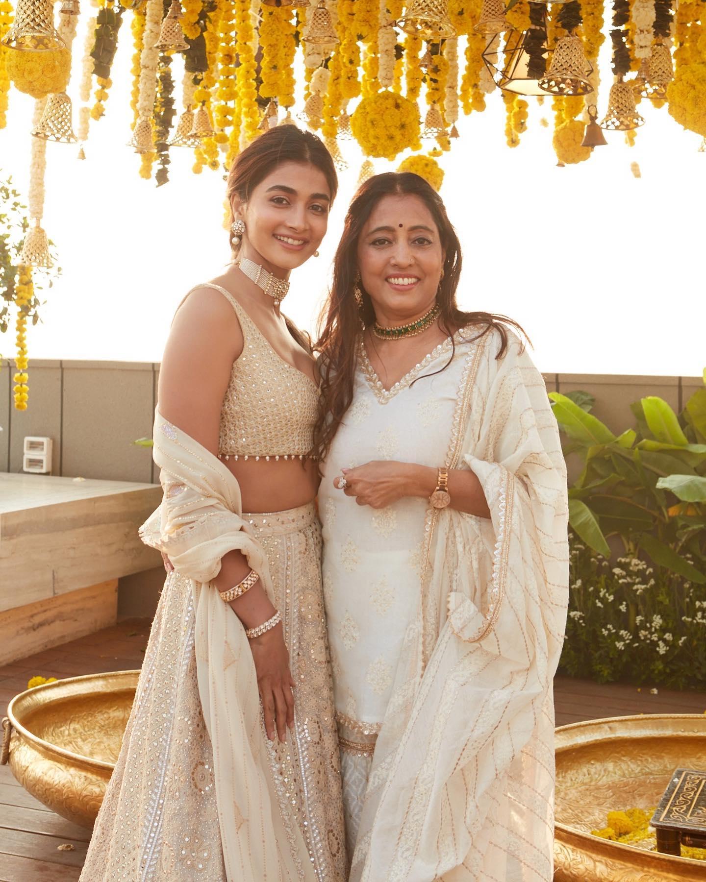 Pooja Hegde Poses with Friend in Cream Dresses Wallpaper