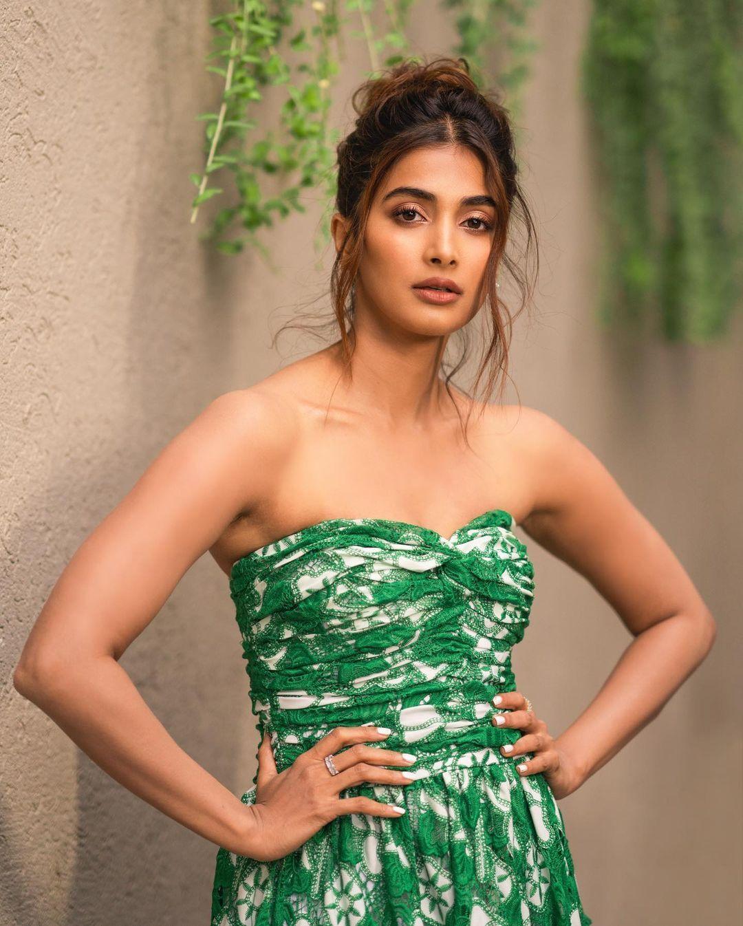 Pooja Hegde Posing Confidently in Green Strapless Dress