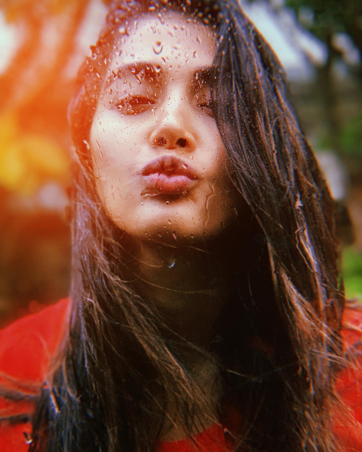 Pooja Hegde Posing in Red with Wet Hair and Sunlight Glow