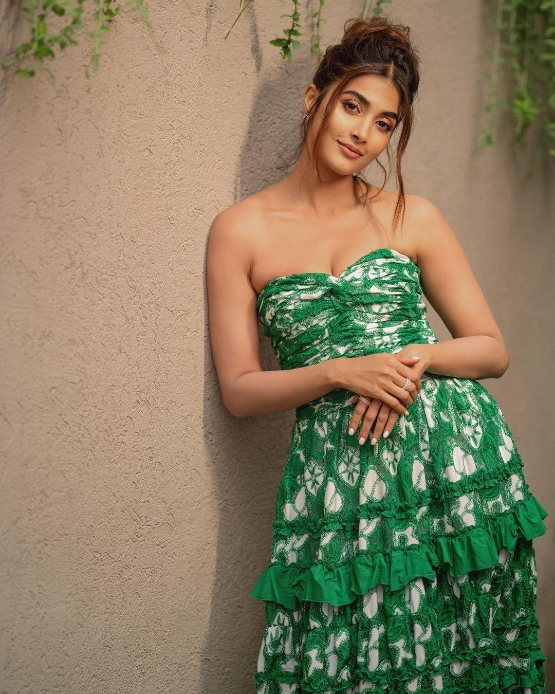 Pooja Hegde Posing in Strapless Green Dress By Wall Image