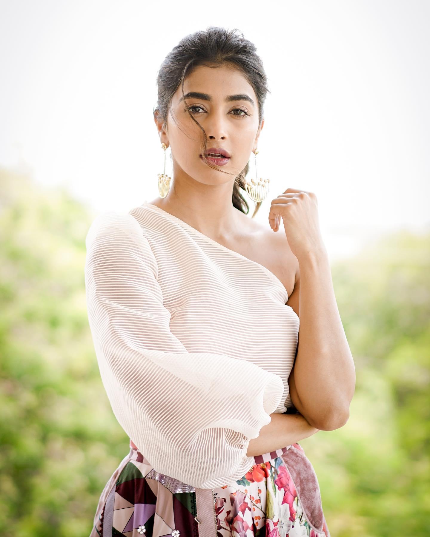 Pooja Hegde Posing Outdoors in Soft White Top with Nature