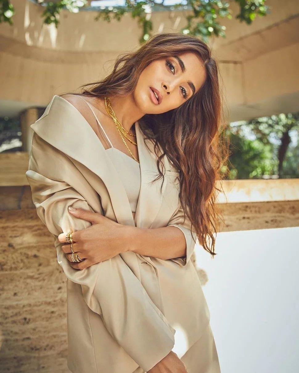Pooja Hegde Posing Outdoors Wearing Beige Outfit Relaxed