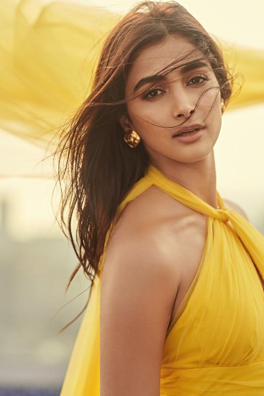 Pooja Hegde Radiates Elegance in Yellow Halter Dress