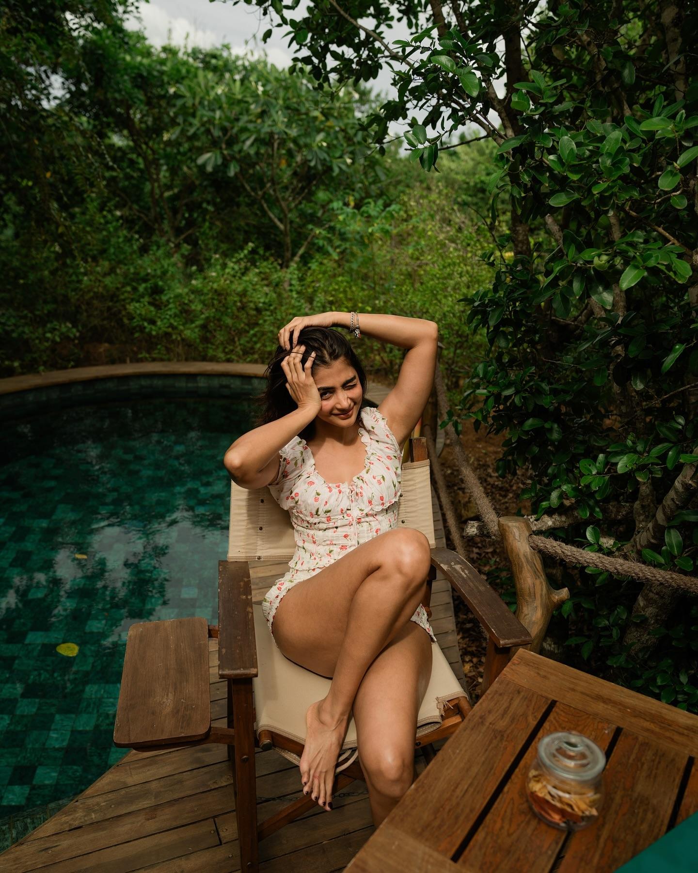 Pooja Hegde Relaxes By Pool in White Printed Outfit