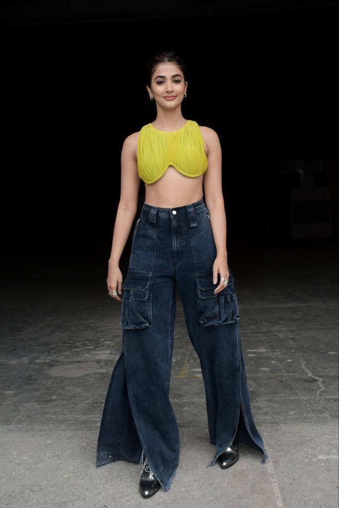Pooja Hegde Rocks Neon Top with Wide Leg Jeans and Style