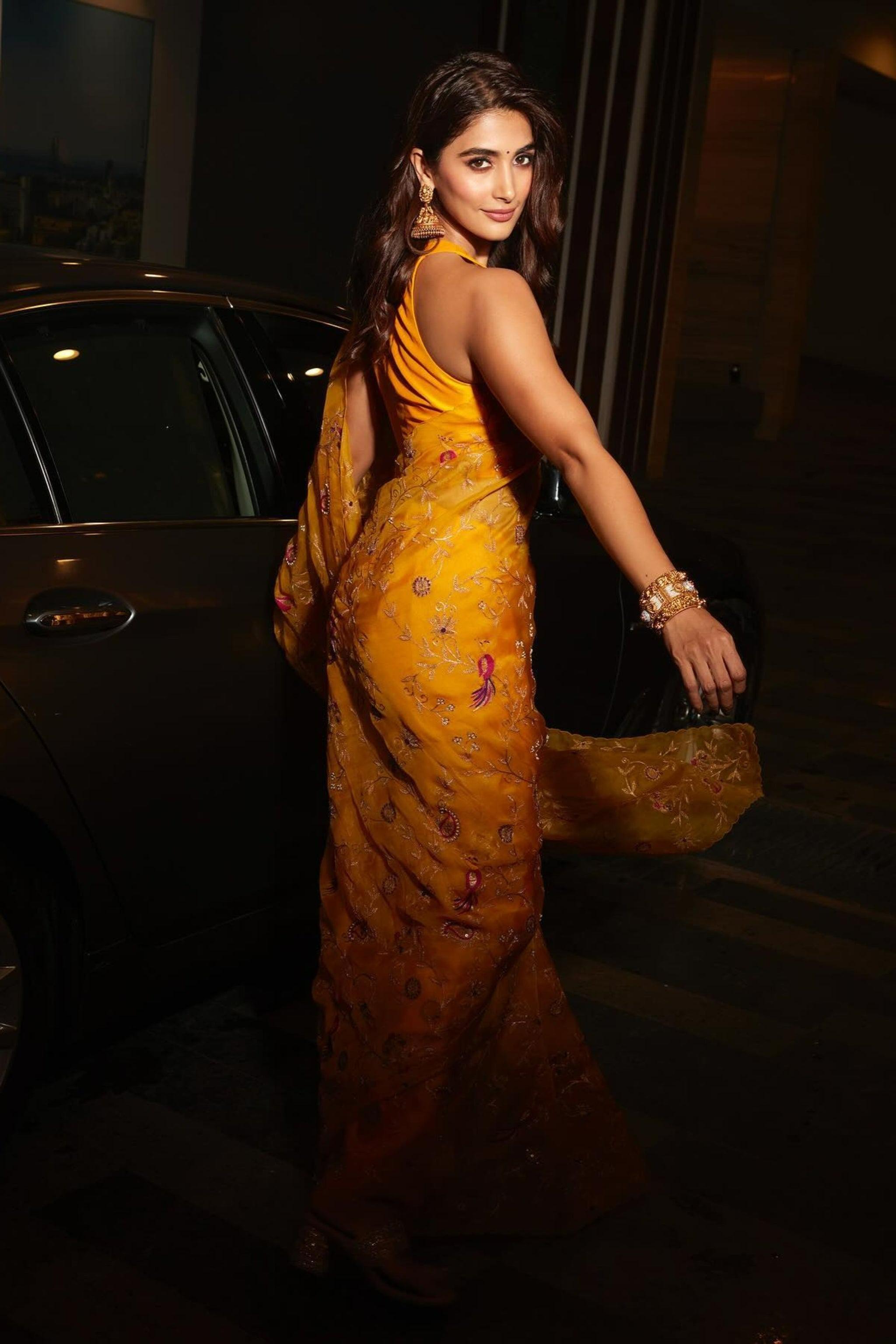 Pooja Hegde Shines in Yellow Saree Near a Black Car
