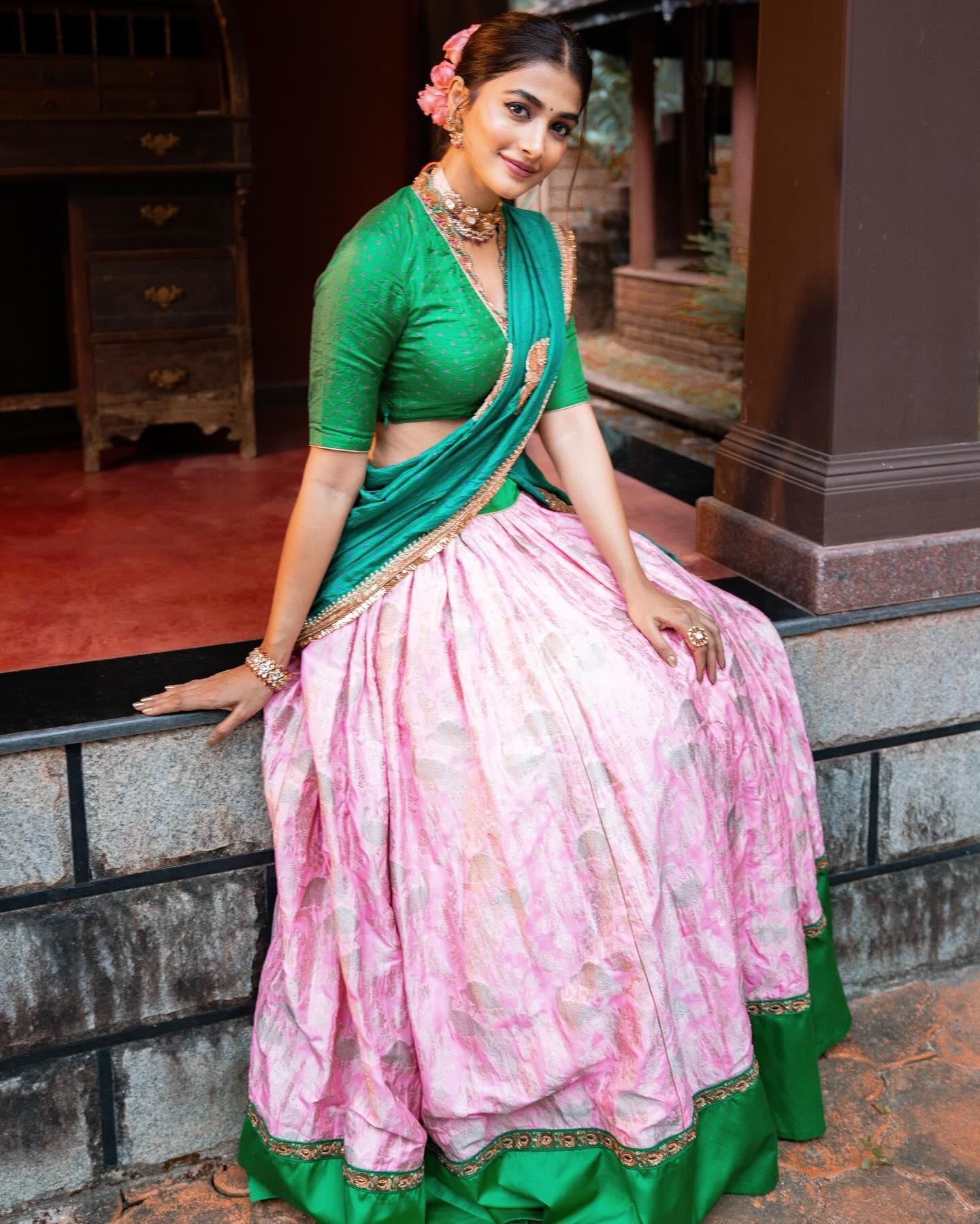 Pooja Hegde Sits in a Colorful Traditional Outfit Wallpaper