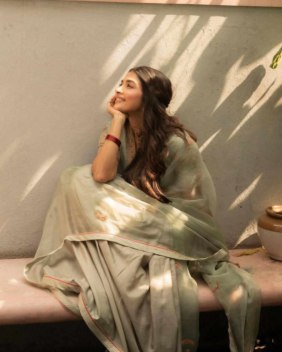 Pooja Hegde Sitting Gracefully in Traditional Outfit