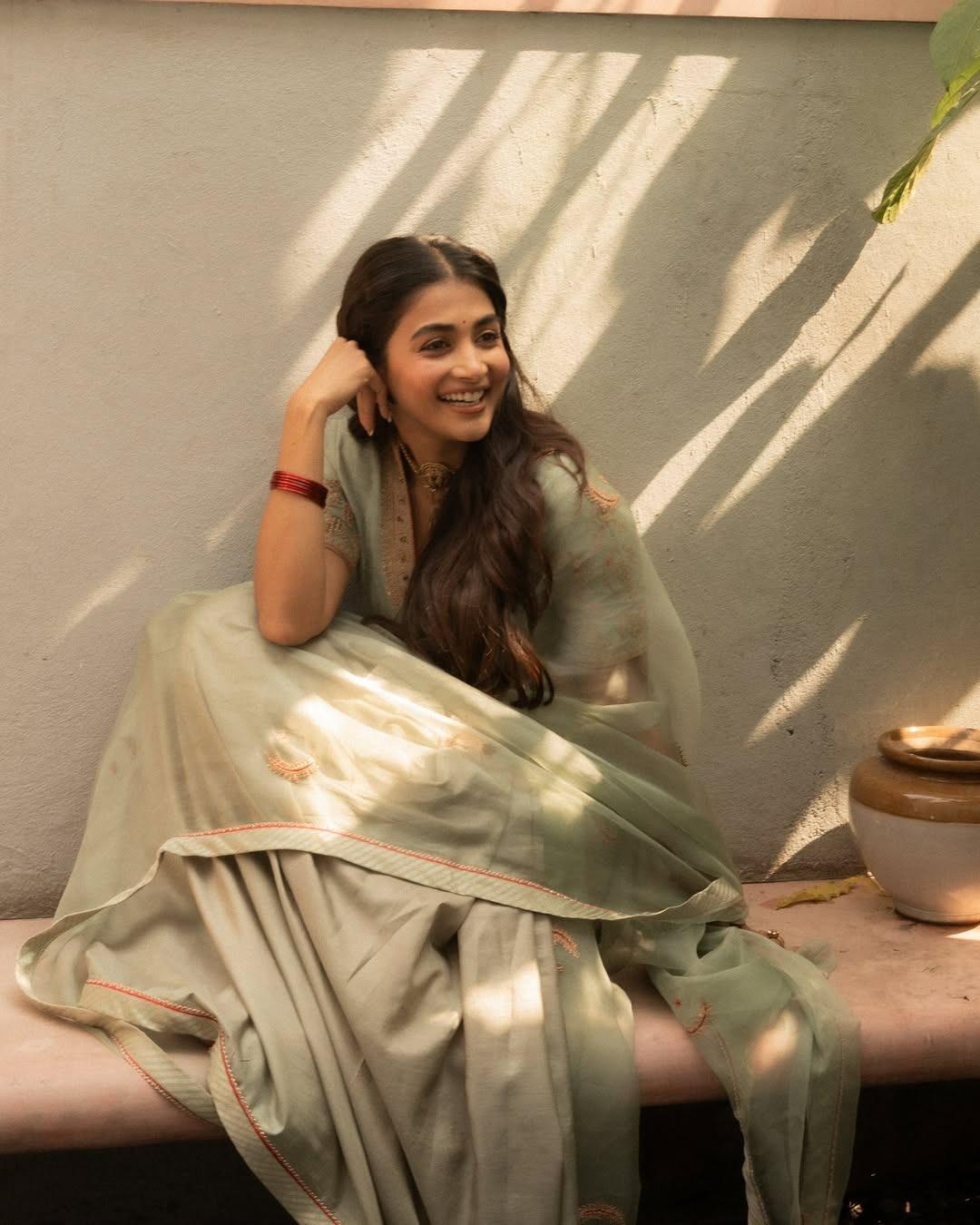 Pooja Hegde Sitting Happily in Pastel Ethnic Attire