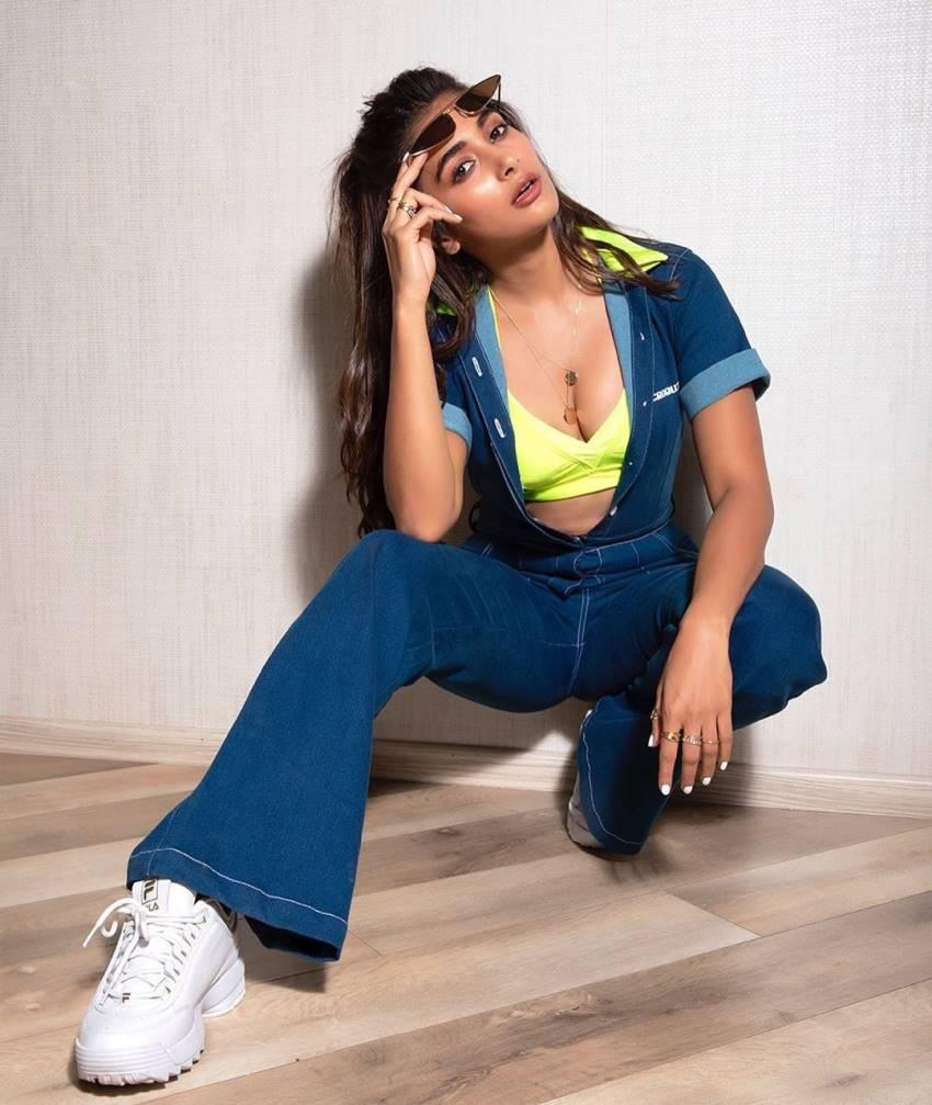 Pooja Hegde Sitting on Floor Wearing Blue Outfit and Sneakers